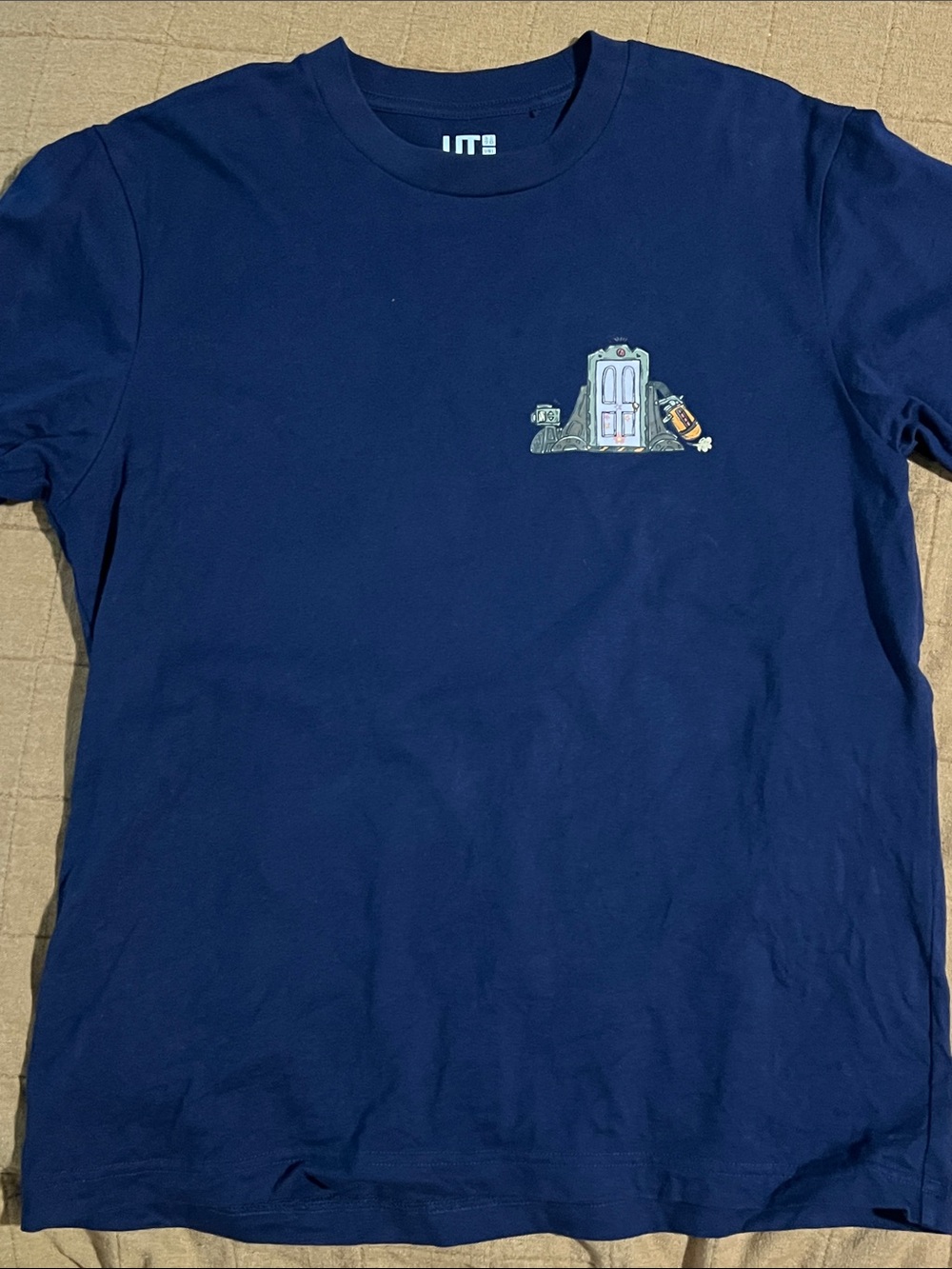 Uniqlo Navy Short Sleeve Tee with Small Door Graphic